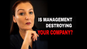Business owner with a serious expression beside the question “Is management destroying your company?” about toxic leadership and company value.